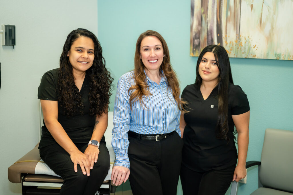 The Liberty Family Care & Wellness team in an exam room at the Rowlett, TX clinic